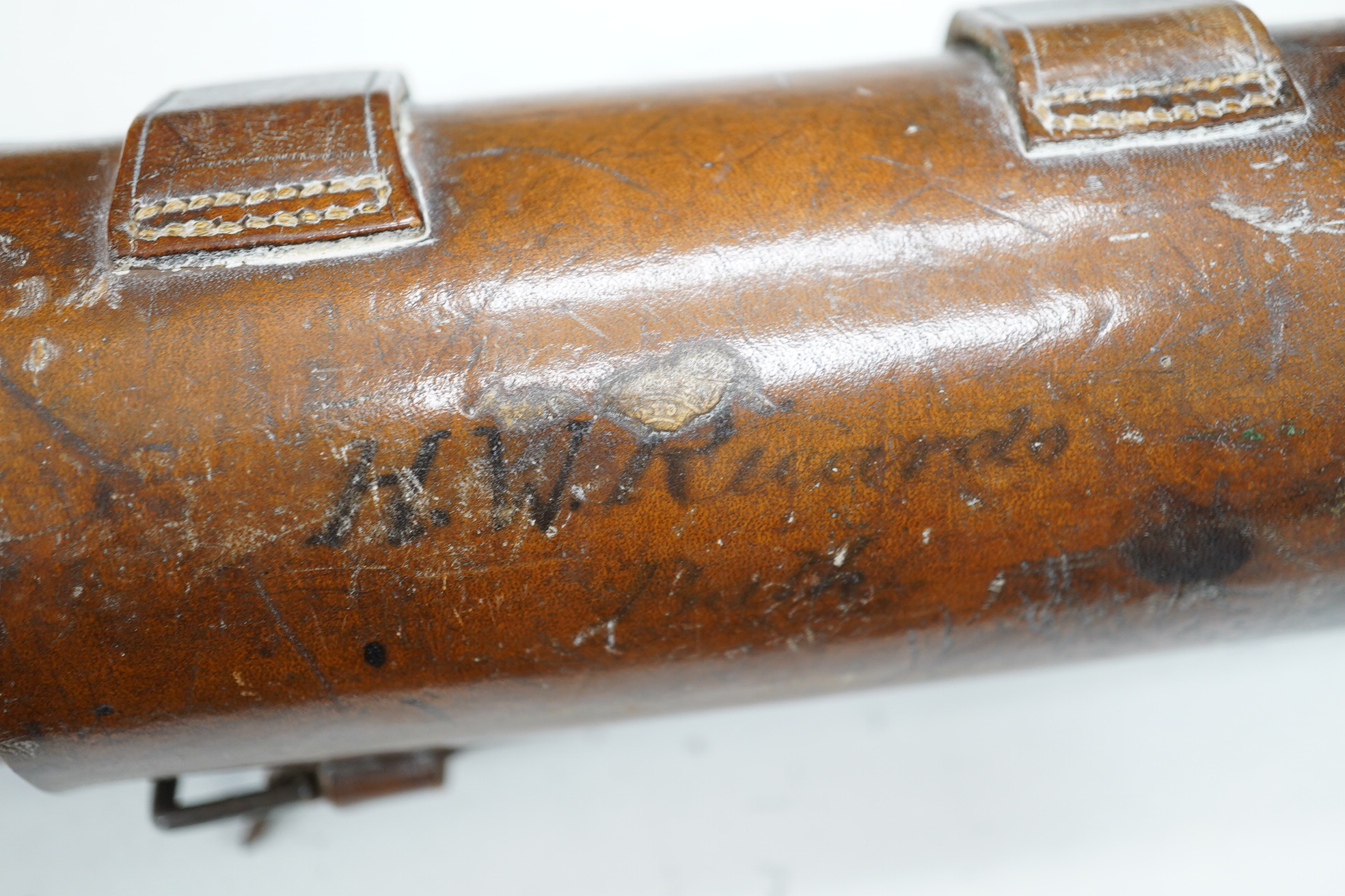 A leather cased Dolland three draw telescope, 72cm fully drawn. Condition - fair considering use